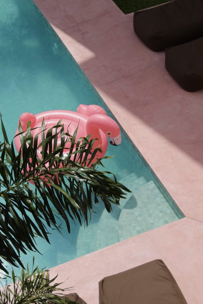 Pink terrace and pool with a flamingo float